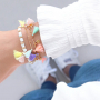 Alegres brazaletes, pulseras tobillera y cordones para gafas adornados con borlas para este verano