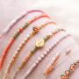 Elegantes pendientes y pulseras con los abalorios faceteados cubo