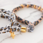 Crea divertidas pulseras y coleteros para pelo con la cinta el&aacute;stica cosida leopardo:
