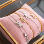 Joyas que puedes crear con las nuevas piezas entrepiezas en forma de a&ntilde;o de acero inoxidable: