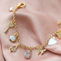 Pendientes y pulseras de tendencia con colgantes y entrepiezas con zirconia: