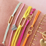 Crea coloridas pulseras con hilo de sat&eacute;n y entrepiezas de acero inoxidable