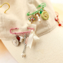 Trucos para dise&ntilde;ar con broches imperdibles decorativos con ojales